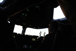 U.S. Air Force Maj. Mark Smith a reservist with the 317th Airlift Squadron, 437th Air Mobility Wing, Charleston Air Force Base, S.C., conducts pre-flight operations prior to departing in support of relief efforts to Haiti, Jan. 14, 2010, in the aftermath of a devastating earthquake.  (U.S. Air Force photo by Staff Sgt. Joshua L. DeMotts) (Released)