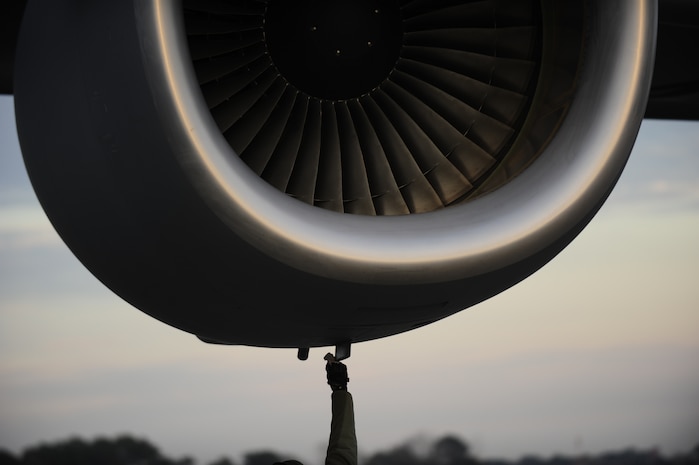 U.S.Air Force Staff Sgt. Matthew Cain, with the 315th Air Maintenance Squadron, 437th Air Mobility Wing, Charleston Air Force Base, S.C., wipes liquid off of a Charleston AFB C-17 Globemaster III, prior to it's  participation in a swift and coordinated relief effort to Haiti in the aftermath of a devastating earthquake.  (U.S. Air Force photo by Staff Sgt. Joshua L. DeMotts) (Released)
