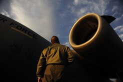 U.S.Air Force Maj. Mark Smith a reservist with the 317th Airlift Squadron, 437th Air Mobility Wing, Charleston Air Force Base, S.C., conducts a pre-flight walk around inspection prior to participating in a swift and coordinated relief effort to Haiti, Jan.14, 2010, in the aftermath of a devastating earthquake.  (U.S. Air Force photo by Staff Sgt. Joshua L. DeMotts) (Released)