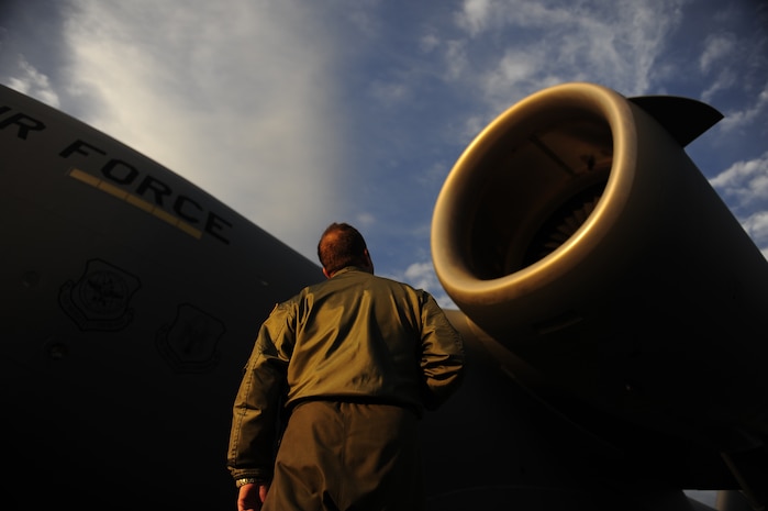 U.S.Air Force Maj. Mark Smith a reservist with the 317th Airlift Squadron, 437th Air Mobility Wing, Charleston Air Force Base, S.C., conducts a pre-flight walk around inspection prior to participating in a swift and coordinated relief effort to Haiti, Jan.14, 2010, in the aftermath of a devastating earthquake.  (U.S. Air Force photo by Staff Sgt. Joshua L. DeMotts) (Released)