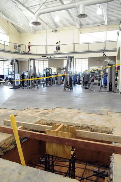 BARKSDALE AIR FORCE BASE, La. -- Fitness center equipment is temporarily relocated to basketball court one while pylons are added to the cardio-theater as part of the center’s phase one construction. During phase two, a second floor will be added above the cardio-theater. The construction will last approximately 240 days and cost more than $600,000. (U.S. Air Force photo by Senior Airman Joanna M. Kresge)