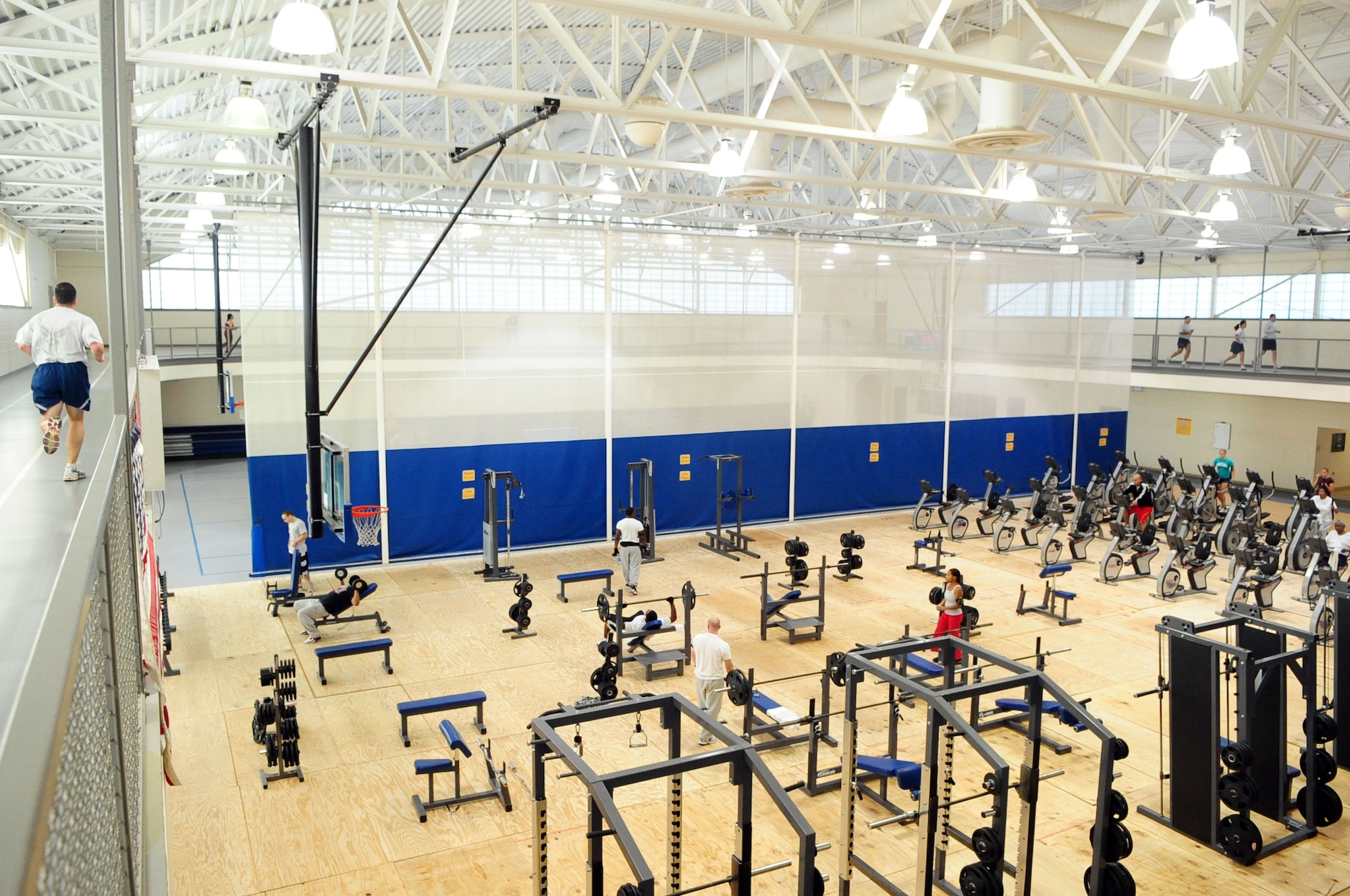 BARKSDALE AIR FORCE BASE, La. -- Fitness center equipment is temporarily relocated to basketball court one while pylons are added to the cardio-theater as part of the center’s phase one construction. During phase two, a second floor will be added above the cardio-theater. The construction will last approximately 240 days and cost more than $600,000. (U.S. Air Force photo by Senior Airman Joanna M. Kresge)