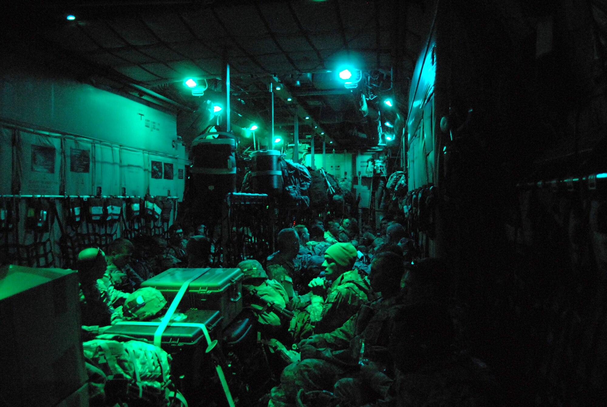 Members of the 82nd Airborne Division, Fort Bragg sit in a C-130 while making their approach to Port-au-Prince Airport, Haiti, Jan. 14. The Soldiers are being transported by the 440th Airlift Wing to support Humanitarian relief efforts and provide essential airfield security after a 7.0-magnitude earthquake devastated the Caribbean nation Jan 12. (U.S. Air Force photo/Senior Airman Kris Levasseur)