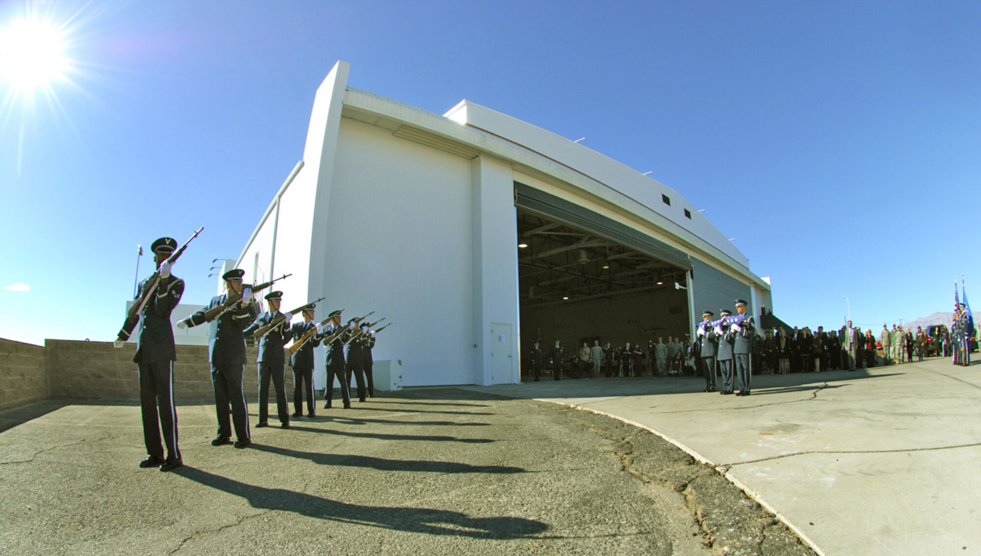 Honor guard members perform a rifle volley salute in honor of Maj. Russell Goodman outside the Thunderbird hanger Jan. 14, 2010, at Nellis Air Force Base, Nev. Major Goodman served as the narrator for the Air Force Thunderbirds from 1964 to 1965 and was declared missing in action after his aircraft was hit by a surface-to-air missile in February 1967 while on a combat mission over North Vietnam. (U.S. Air Force photo/Staff Sgt. William P. Coleman) 

