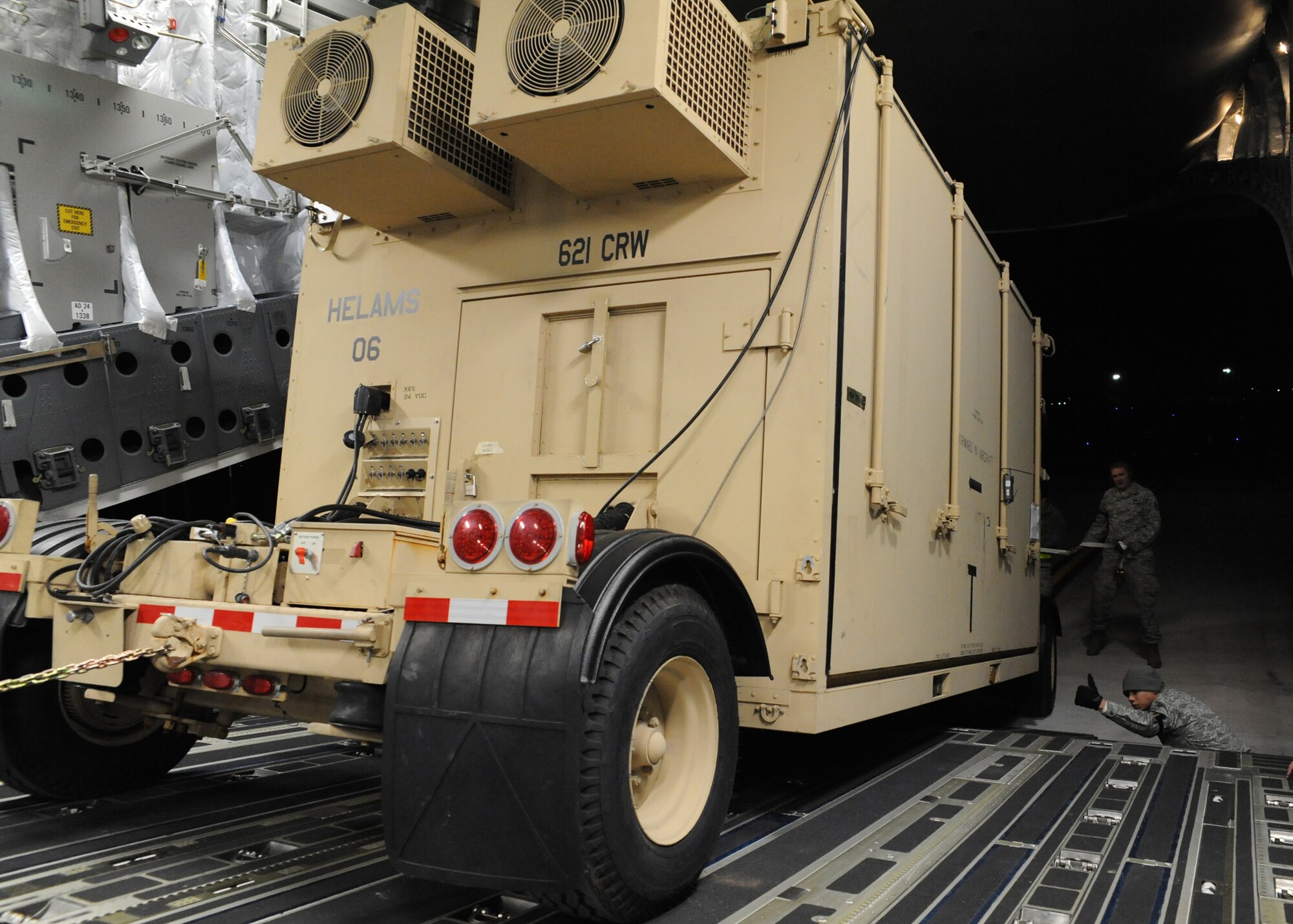 A mobile command and control communications center is loaded onto a Charleston AFB C-17 at Joint Base McGuire-Dix-Lakehurst, New Jersey, Jan. 15, 2010. The 621st Contingency Response Wing at JB MDL deployed ground forces to set up air base operations to set the stage for expedient supply of humanitarian aid. Additionally, AMC has aeromedical assets that can take care of and transport injured people to follow-on care. (U.S.Air Force photo/Senior Airman Katie Gieratz) (U.S. Air Force photo/Senior Airman Katie Gieratz)(RELEASED)