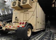 A mobile command and control communications center is loaded onto a Charleston AFB C-17 at Joint Base McGuire-Dix-Lakehurst, New Jersey, Jan. 15, 2010. The 621st Contingency Response Wing at JB MDL deployed ground forces to set up air base operations to set the stage for expedient supply of humanitarian aid. Additionally, AMC has aeromedical assets that can take care of and transport injured people to follow-on care. (U.S.Air Force photo/Senior Airman Katie Gieratz) (U.S. Air Force photo/Senior Airman Katie Gieratz)