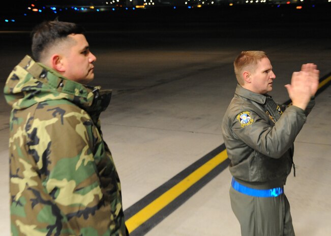 Master Sgt. Michael Lang and Tech. Sgt. Robert Mabry marshal equipment onto a Charleston C-17 at Joint Base McGuire-Dix-Lakehurst, New Jersey, Jan. 15, 2010. Air Mobility Command is responding with all necessary forces and equipment to aide the humanitarian efforts in Haiti. Sergeants Lang and Mabry are loadmasters with the 317th Airlift Squadron. (U.S. Air Force photo/Senior Airman Katie Gieratz)(RELEASED)