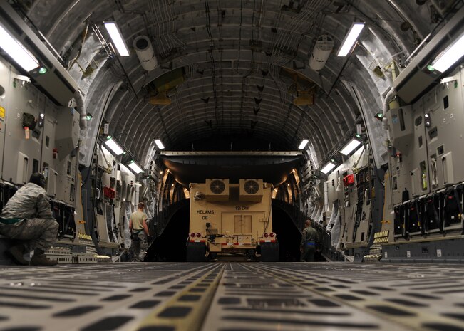 Equipment is unloaded from a Charleston C-17 in Port-au-Prince, Haiti, Jan. 15, 2010. Air Mobility Command is assisting the humanitarian relief effort in Haiti by bringing the assets necessary to run airfield operations, air traffic control, command and control, aerial port, maintenance, and security. Additionally AMC has aeromedical assets that can take care of and transport injured people to follow-on care. (U.S.Air Force photo/Senior Airman Katie Gieratz)(RELEASED)