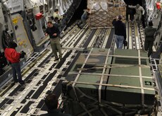 Equipment is loaded onto C-17 at Joint Base McGuire-Dix-Lakehurst, New Jersey, Jan. 15, 2010. The Charleston C-17 was used to transport equipment needed to aid the humanitarian effort in Haiti. (U.S. Air Force photo/Senior Airman Katie Gieratz)