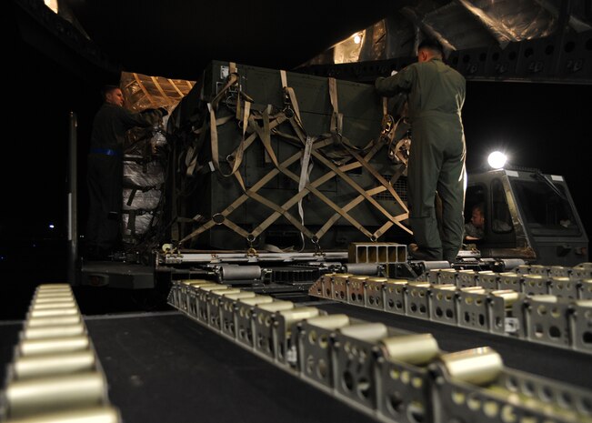 Equipment is loaded onto a Charleston AFB C-17 at Joint Base McGuire-Dix-Lakehurst, New Jersey, Jan. 15, 2010. The Charleston AFB C-17 was used to transport equipment needed to aid the humanitarian effort in Haiti. (U.S. Air Force photo/Senior Airman Katie Gieratz)(RELEASED)