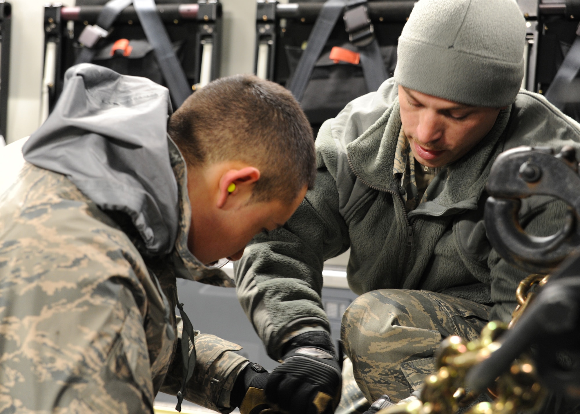 Tech. Sgt. Jeremy Morris and Airman 1st Class Juan Bayron own a mobile command and control unit onto a Charleston AFB C-17 at Joint Base McGuire-Dix-Lakehurst, New Jersey, Jan. 15, 2010. The Charleston AFB C-17 was used to transport equipment needed to aid the humanitarian effort in Haiti. Sergeant Morris and Airman Williams are with the 305th Aerial Port Squadron. (U.S. Air Force photo/Senior Airman Katie Gieratz)(RELEASED)