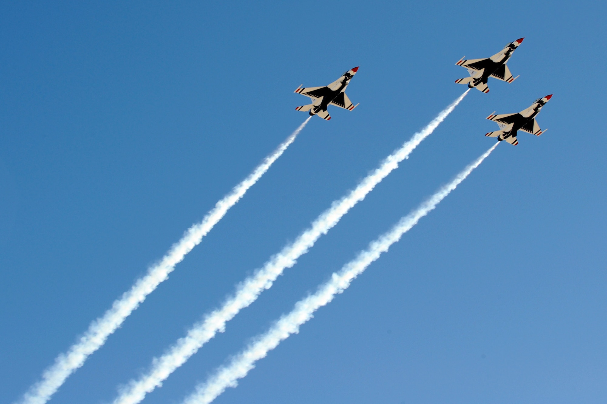 The Air Force Thunderbirds perform the missing man formation during the repatriation and funeral service for Maj. Russell C. Goodman Jan. 14, 2010, at Nellis Air Force Base, Nev. Major Goodman served as the narrator for the Air Force Thunderbirds from 1964 to 1965 and was declared missing in action after his aircraft was hit by a surface-to-air missile in February 1967 while on a combat mission over North Vietnam. (U.S. Air Force photo/Lawrence Crespo)

