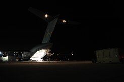 Equipment is loaded onto a Charleston AFB C-17 at Joint Base McGuire-Dix-Lakehurst, New Jersey, Jan. 15, 2010. Air Mobility Command is assisting the humanitarian relief effort in Haiti by bringing the assets necessary to run airfield operations, air traffic control, command and control, aerial port, maintenance, and security. Additionally, AMC has aeromedical assets that can take care of and transport injured people to follow-on care. (U.S.Air Force photo/Senior Airman Katie Gieratz)