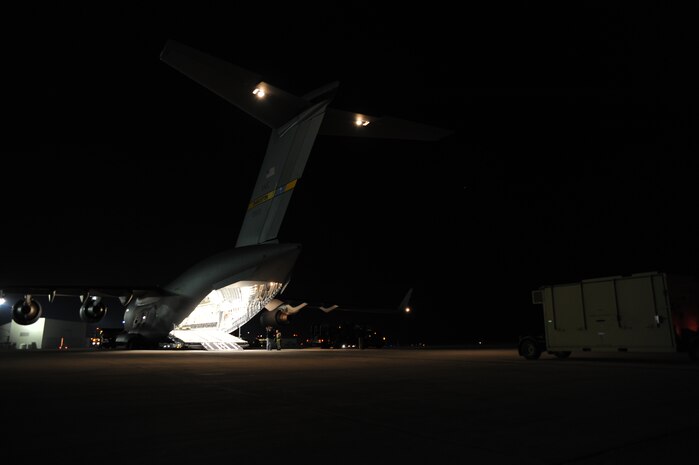 Equipment is loaded onto a Charleston AFB C-17 at Joint Base McGuire-Dix-Lakehurst, New Jersey, Jan. 15, 2010. Air Mobility Command is assisting the humanitarian relief effort in Haiti by bringing the assets necessary to run airfield operations, air traffic control, command and control, aerial port, maintenance, and security. Additionally, AMC has aeromedical assets that can take care of and transport injured people to follow-on care. (U.S.Air Force photo/Senior Airman Katie Gieratz)(RELEASED)