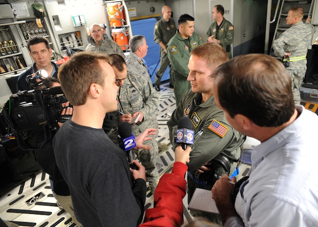 Tech. Sgt. Robert Mabry is interviewed by local media on a C-17 on the Charleston AFB flightline Jan. 14, 2010. The C-17 was used to transport equipment needed to aid the humanitarian effort in Haiti. Sergeant Mabry is a loadmaster with the 317th Airlift Squadron.(U.S.Air Force photo/Senior Airman Katie Gieratz)(RELEASED)
