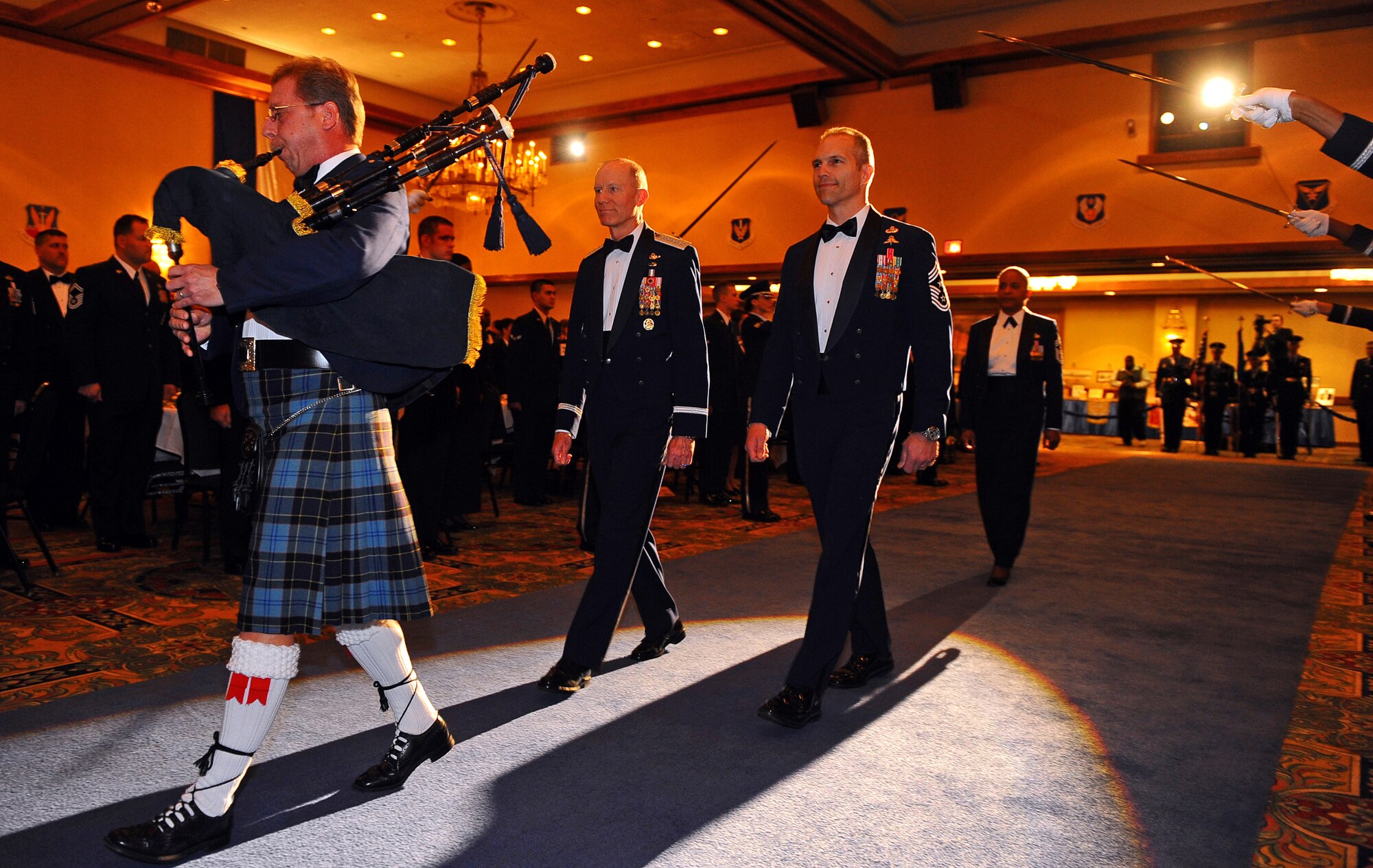 OFFUTT AIR FORCE BASE, Neb. - (Left) Retired Gen. John D.W. Corley, former commander of Air Combat Command, and ACC Command Chief Master Sgt. Martin Klukas follow a bagpiper on their way to the head table during an Order of the Sword ceremony honoring General Corley at the Doubletree Hotel in Omaha, Neb., Jan. 13.  The Order of the Sword is the highest honor awarded by the U.S. Air Force enlisted corps.  

U.S. Air Force photo by Josh Plueger

