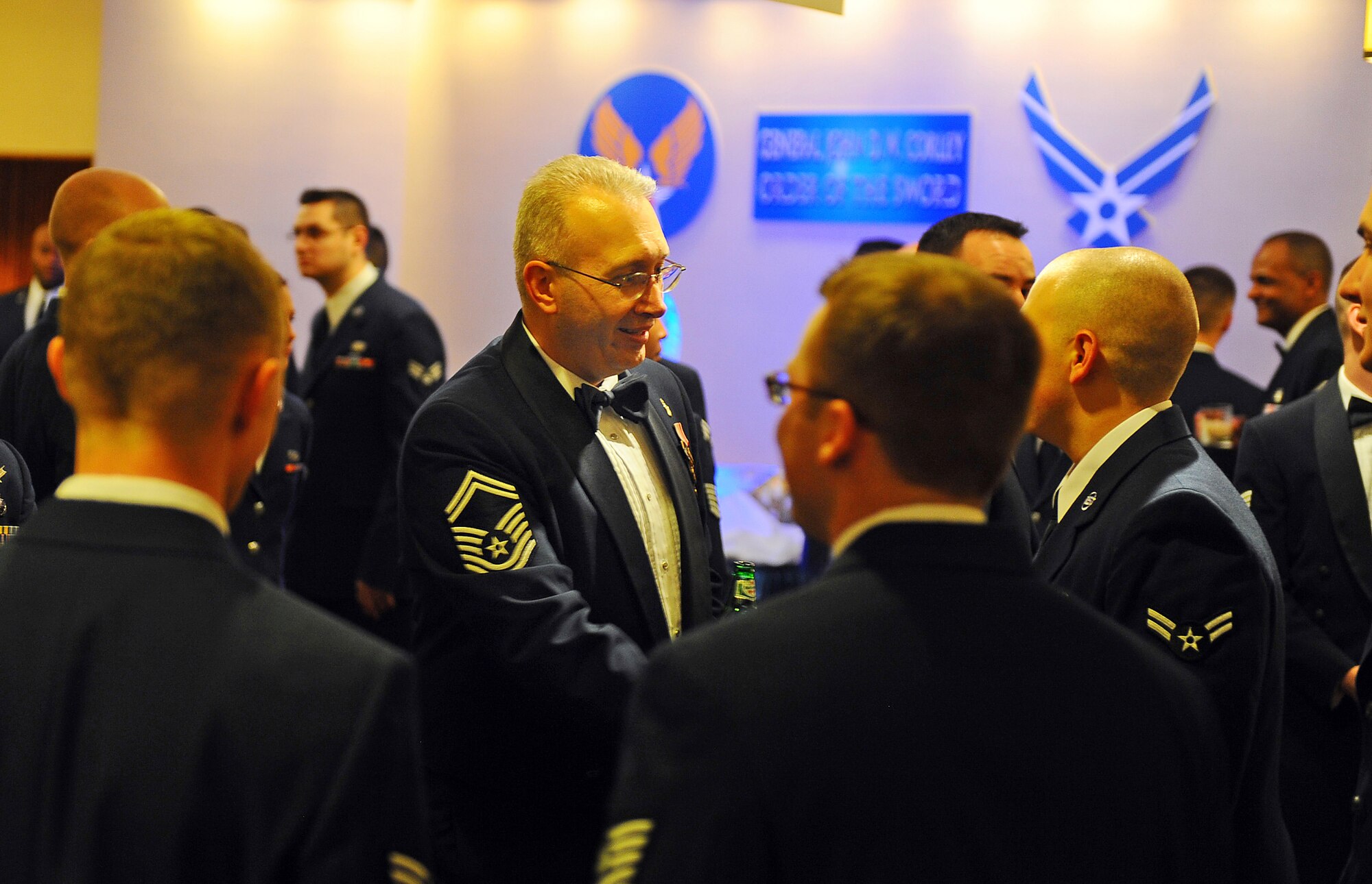 OFFUTT AIR FORCE BASE, Neb. - Senior Master Sgt. Richard Baker, a member of the 633rd Aerospace Medical Squadron at Langley AFB, Va., meets with young Airmen during a social hour preceeding an Order of the Sword ceremony honoring retired Gen. John D.W. Corley, former commander of Air Combat Command, held at the Doubletree Hotel  in Omaha, Neb., Jan. 13.  The Order of the Sword is the highest honor awarded by the U.S. Air Force enlisted corps.

U.S. Air Force photo by Josh Plueger
