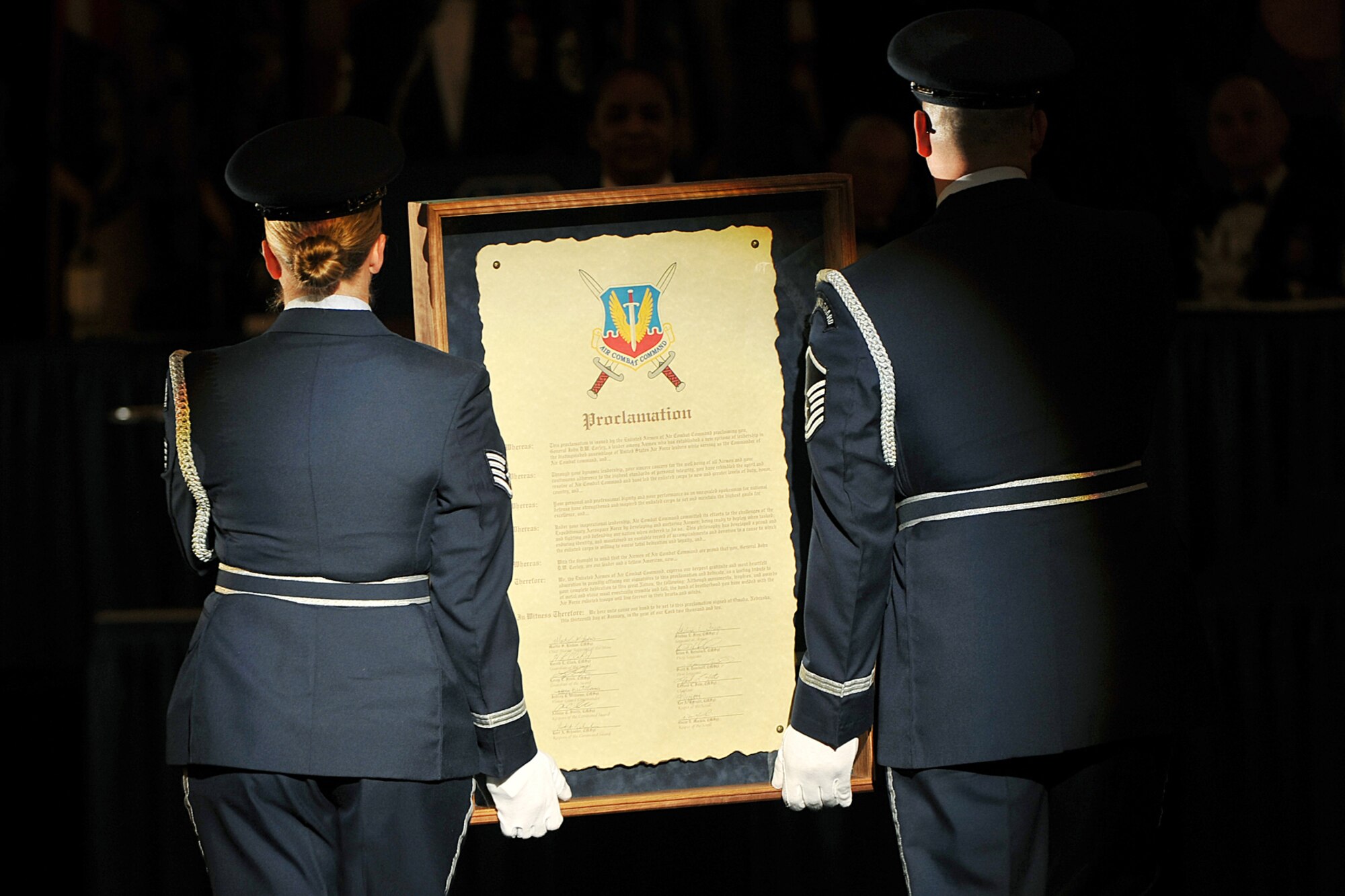 OFFUTT AIR FORCE BASE, Neb. - Base Honor Guard members carry a proclamation scroll during an Air Combat Command Order of the Sword ceremony at the Doubletree Hotel in Omaha, Neb., Jan. 14. The proclamation declared retired Gen. John D.W. Corley, former ACC commander, "a leader among Airmen."

U.S. Air Force photo by Charles Haymond
[CLEARED] by Deborah Aragon
