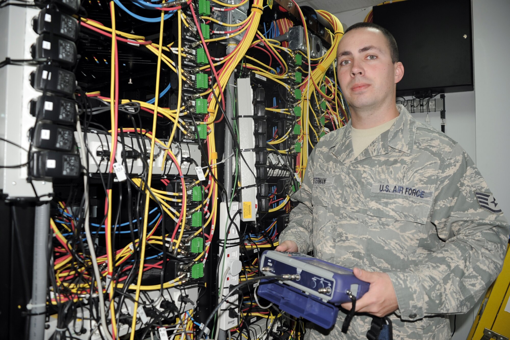Staff Sgt. Randy Reiterman, cable television engineering and installation craftsman with the 380th Expeditionary Communications Squadron, tests cable mounts in his workcenter Jan. 15, 2010, at a non-disclosed location in Southwest Asia.  Sergeant Reiterman is responsible for supporting the massive networking of television capability across the 380th Air Expeditionary Wing?s infrastructure along with other commercial network support. He is deployed from the 5th Communications Squadron at Minot Air Force Base, N.D., and his hometown is Warren, Mich.  (U.S. Air Force Photo/Tech. Sgt. Scott T. Sturkol/Released)