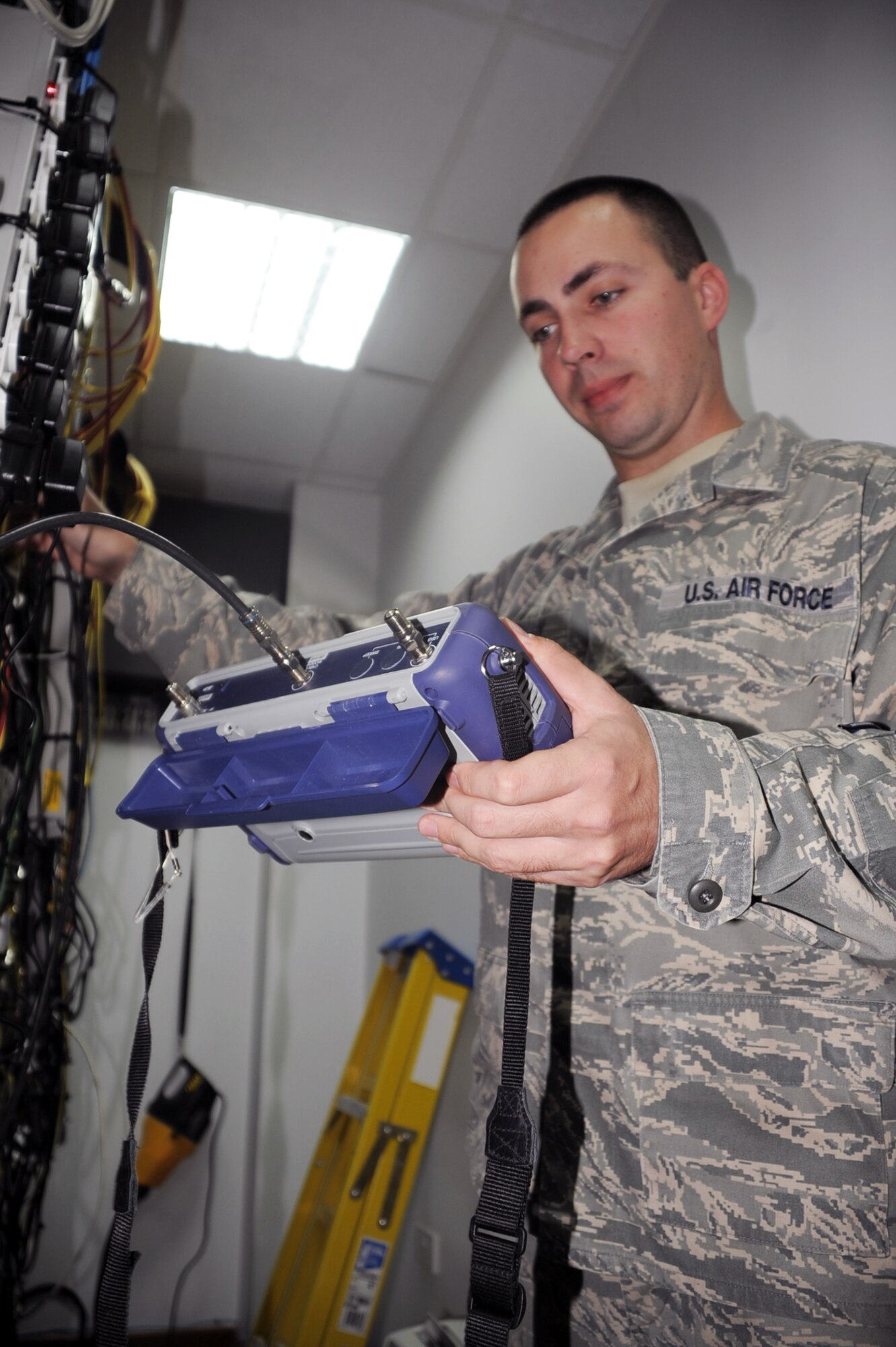 Staff Sgt. Randy Reiterman, cable television engineering and installation craftsman with the 380th Expeditionary Communications Squadron, tests cable mounts in his workcenter Jan. 15, 2010, at a non-disclosed location in Southwest Asia.  Sergeant Reiterman is responsible for supporting the massive networking of television capability across the 380th Air Expeditionary Wing?s infrastructure along with other commercial network support. He is deployed from the 5th Communications Squadron at Minot Air Force Base, N.D., and his hometown is Warren, Mich.  (U.S. Air Force Photo/Tech. Sgt. Scott T. Sturkol/Released)
