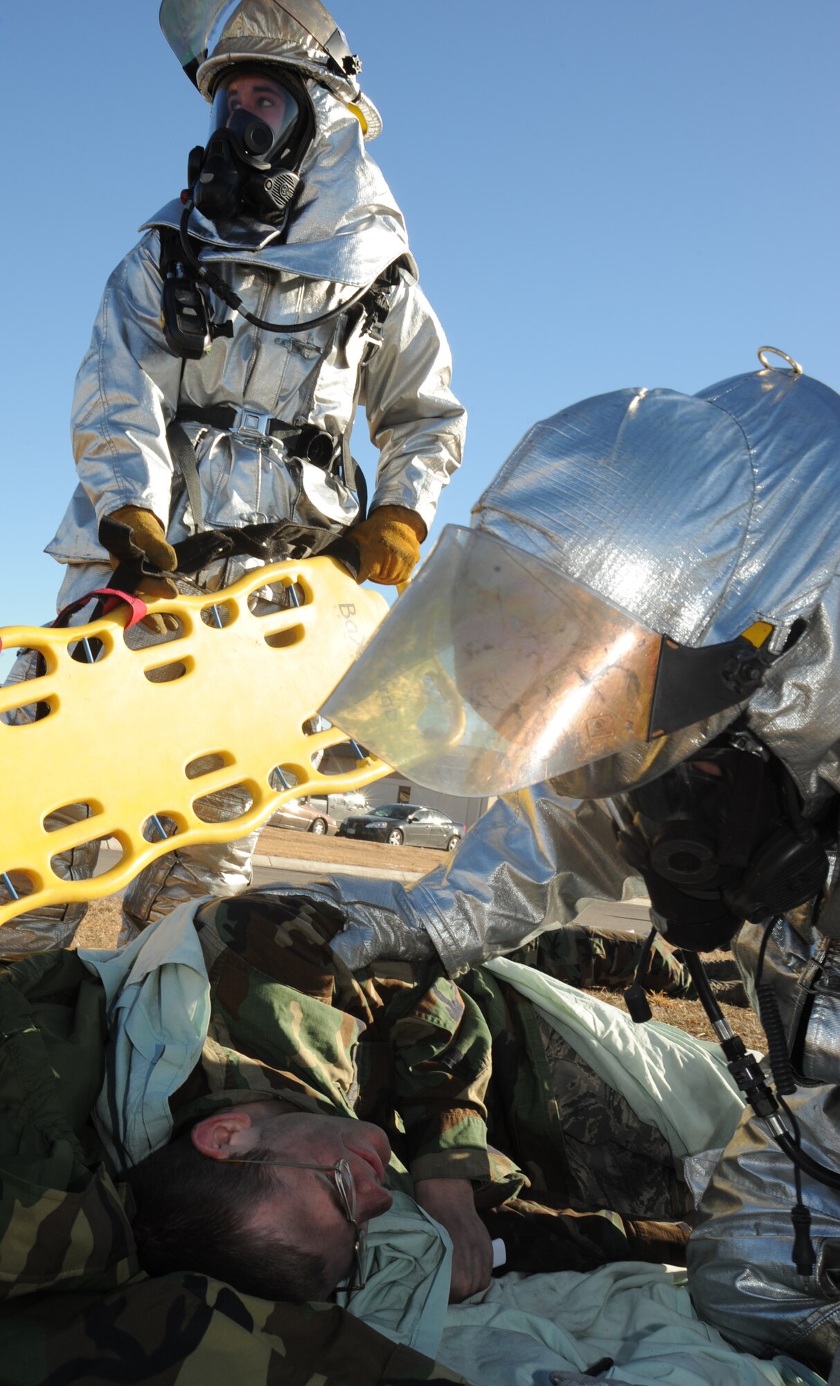 McConnell firefighters prepare an Airman acting as a victim for transportation during a major accident response exercise, Jan. 11, 2010, at McConnell Air Force Base, Kan. Airmen from the base fire department, explosive ordnance disposal flight, medical group and security forces were among the critical players in the exercise. The MARE’s purpose was to help Airmen to respond to crisis situations they may face in an Air Mobility Command Unit Compliance Inspection in February (U.S. Air Force Photo/Senior Airman Maria Ruiz)