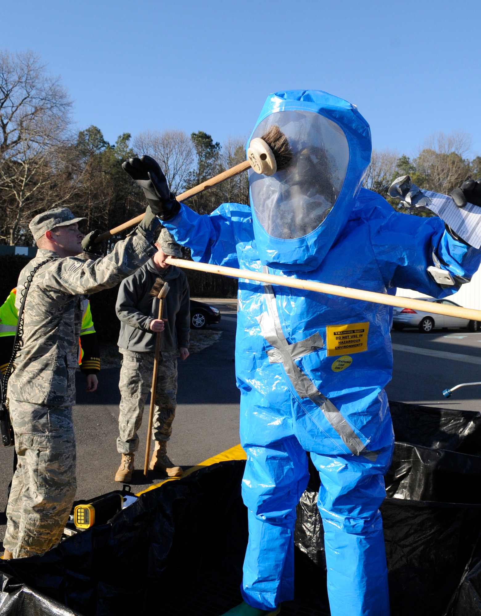 LANGLEY AIR FORCE BASE, Va. – Tech. Sgt. Michael Woodburn, 633d Aerospace Medicine Squadron bioenvironmental technician, goes through the decontamination process line during a Chemical Biological Radiology Nuclear Challenge Jan. 14. The fifth annual CBRNE challenge is an exercise that tests the base’s hazardous incident response capabilities. (U.S. Air Force photo/ Senior Airman Dana Hill)