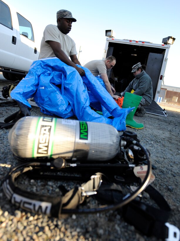 LANGLEY AIR FORCE BASE, Va. – Tech. Sgt. Michael Woodburn, 633d Aerospace Medicine Squadron bioenvironmental technician, dons a Level A fully encapsulated suit during a Chemical Biological Radiology Nuclear Challenge Jan. 14. The fifth annual CBRNE challenge is an exercise that tests the base’s hazardous incident response capabilities. (U.S. Air Force photo/ Senior Airman Dana Hill)