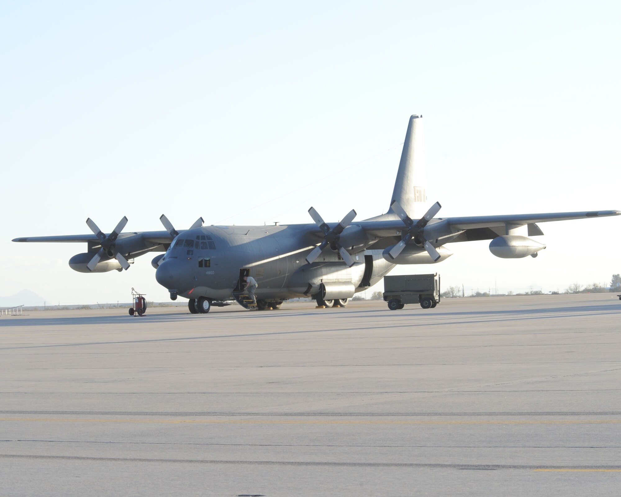 A C-130E from the 79th Rescue Squadron sits on the runway at Davis-Monthan Air Force Base, Ariz., Jan. 14. Another C-130E from the squadron participated in a Haitian relief mission during the evening of Jan. 13 in Port-au-Prince, Haiti. During this mission, Airmen delivered more than 13,000 pounds of cargo to include vehicles and equipment. They also dropped off airfield operations personnel to help set up the airfield in Port-au-Prince and control the relief traffic in and out of the airfield. (U.S. Air Force photo/Staff Sgt. Valerie Smith)


