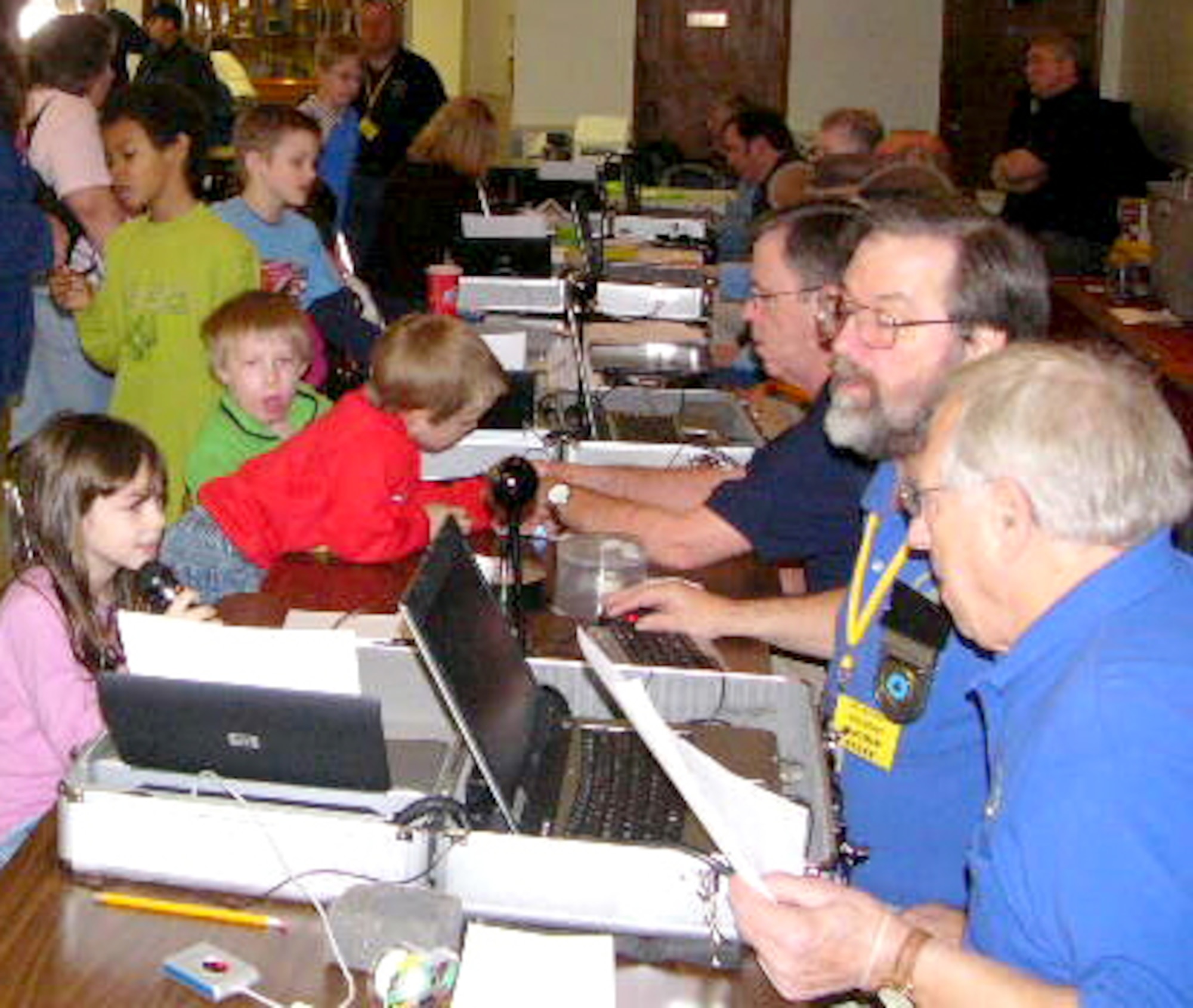 Georgia Child Identification Program volunteers record identification
information for children at the Robins Youth Center during an event held
here this summer.
