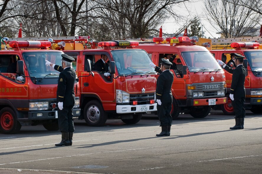 MISAWA CITY, Japan -- Misawa City firefighters run operational checks on their fire trucks at the Misawa Ice Arena Jan. 11. They demonstrated the lights, sirens and other systems, showcasing the fire trucks' capabilities to Misawa City officials. (U.S. Air Force photo/Staff Sgt. Samuel Morse)