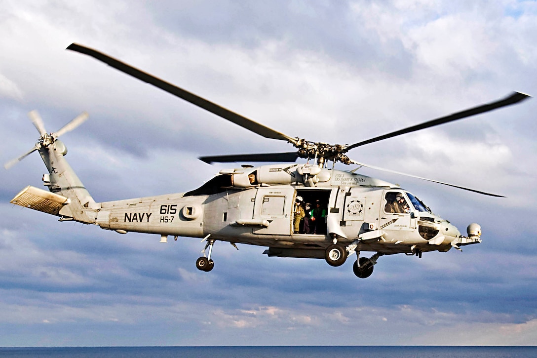 An SH-60F Sea Hawk assigned to Helicopter Squadron 7 lands Jan. 13, 2010, aboard the aircraft carrier USS Carl Vinson, now off the coast of Haiti. The Carl Vinson and Carrier Air Wing 17 received orders to provide humanitarian assistance to the Caribbean nation of Haiti, following a 7.0 magnitude earthquake. 