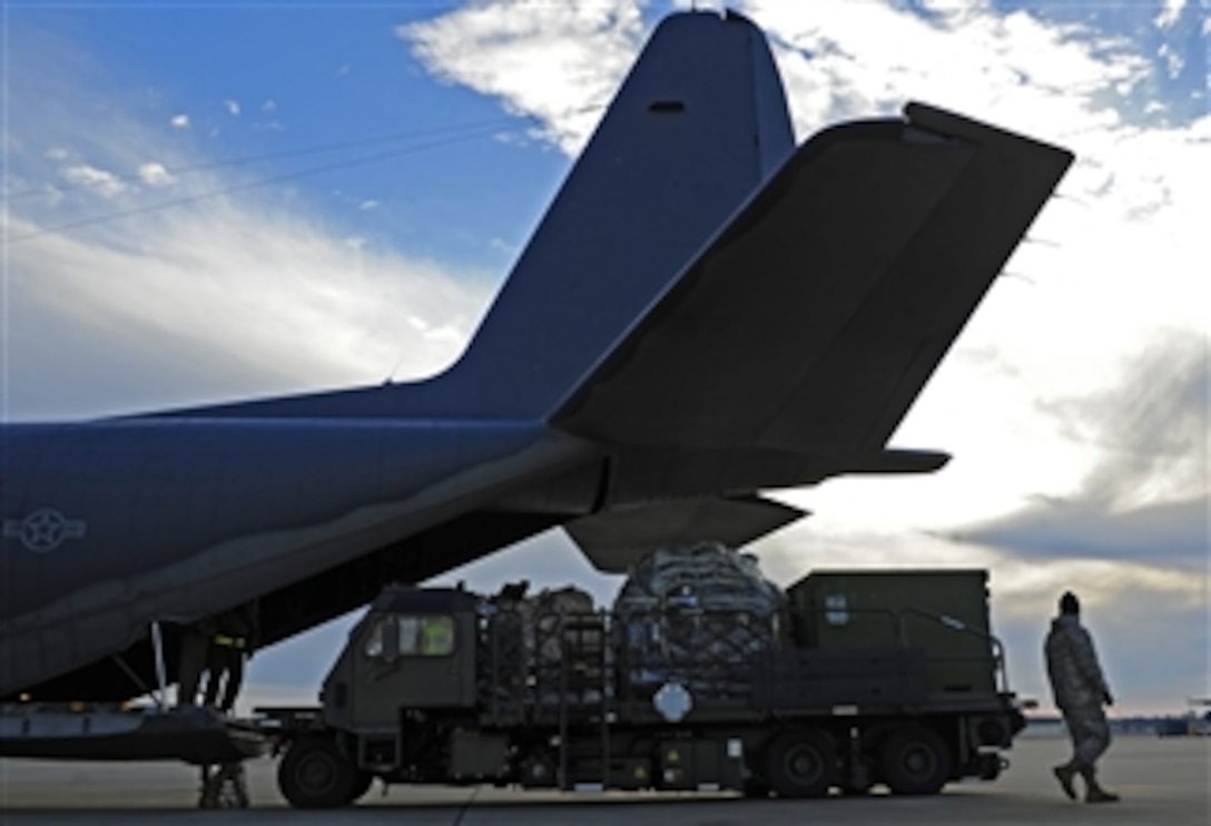 Cargo is loaded onto a U.S. Air Force C-130 Hercules aircraft at Hurlburt Field, Fla., for transport to Haiti in support of humanitarian operations on Jan. 14, 2010.  The Air Force is providing humanitarian assistance and disaster relief to Haiti after a 7.0 magnitude earthquake hit the country on Jan. 12, 2010.  