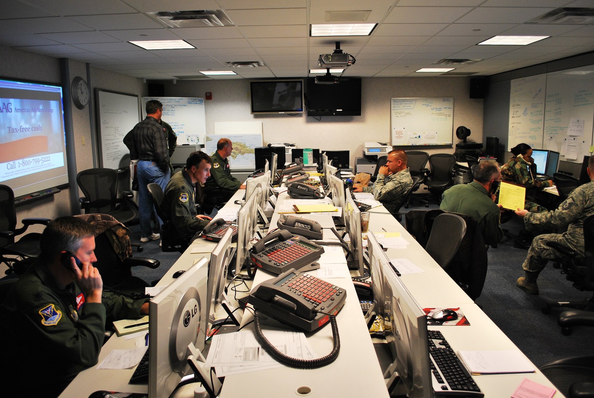 618th Tanker Airlift Control Center personnel provide command-and-control over Air Mobility Command missions supporting relief efforts in Haiti, Jan. 16.  618th TACC personnel have been working around-the-clock since Tuesday to support U.S. relief efforts in Haiti after a 7.0-magnitude earthquake struck the region.  The personnel pictured are part of the Contingency Response Cell, a unit dedicated to the relief efforts in Haiti, enabling other 618th TACC personnel to continue planning missions to support other U.S. operations worldwide, including airlift, air refueling and aeromedical evacation missions in support of Operations Iraqi and Enduring Freedom. (U.S. Air Force photo/Capt. Justin Brockhoff)
