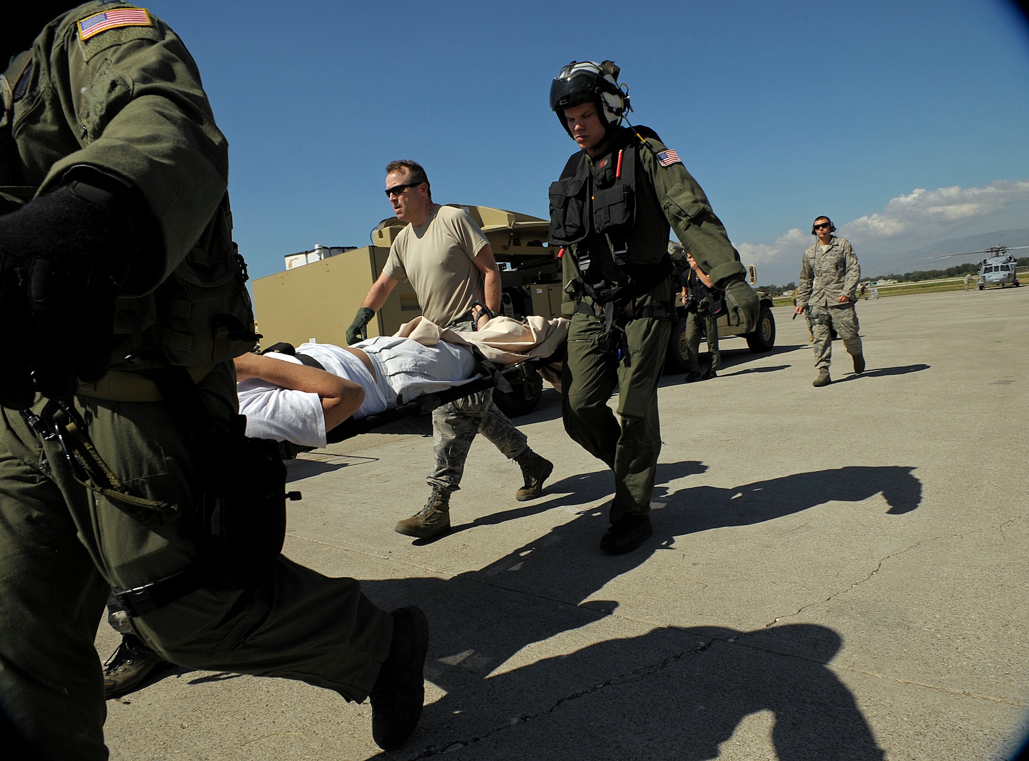 U.S. Airmen from the Air Force Special Operations Command (AFSOC), Hurlburt Field, Fla., offload injured people from a C-130 Hercules aircraft Jan. 15, 2010, after the earthquake in Port-au-Prince, Haiti. AFSOC is providing an immediate rapid response capability to Haiti through U.S. Southern Command. (DoD photo by Master Sgt. Russell E. Cooley IV, U.S. Air Force/Released) 