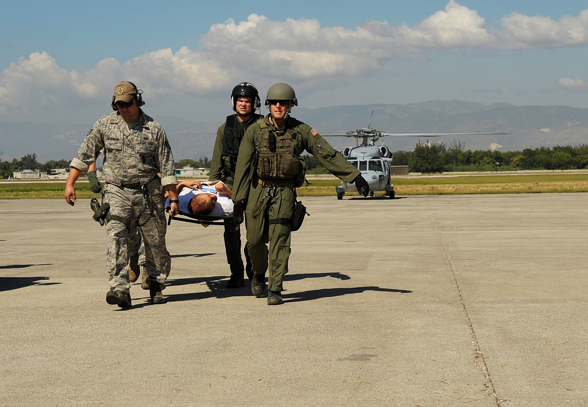 U.S. Airmen from the Air Force Special Operations Command (AFSOC), Hurlburt Field, Fla., offload injured people from a C-130 Hercules aircraft Jan. 15, 2010, after the earthquake in Port-au-Prince, Haiti. AFSOC is providing an immediate rapid response capability to Haiti through U.S. Southern Command. (U.S. Air Force photo by Master Sgt. Russell E. Cooley IV/Released)