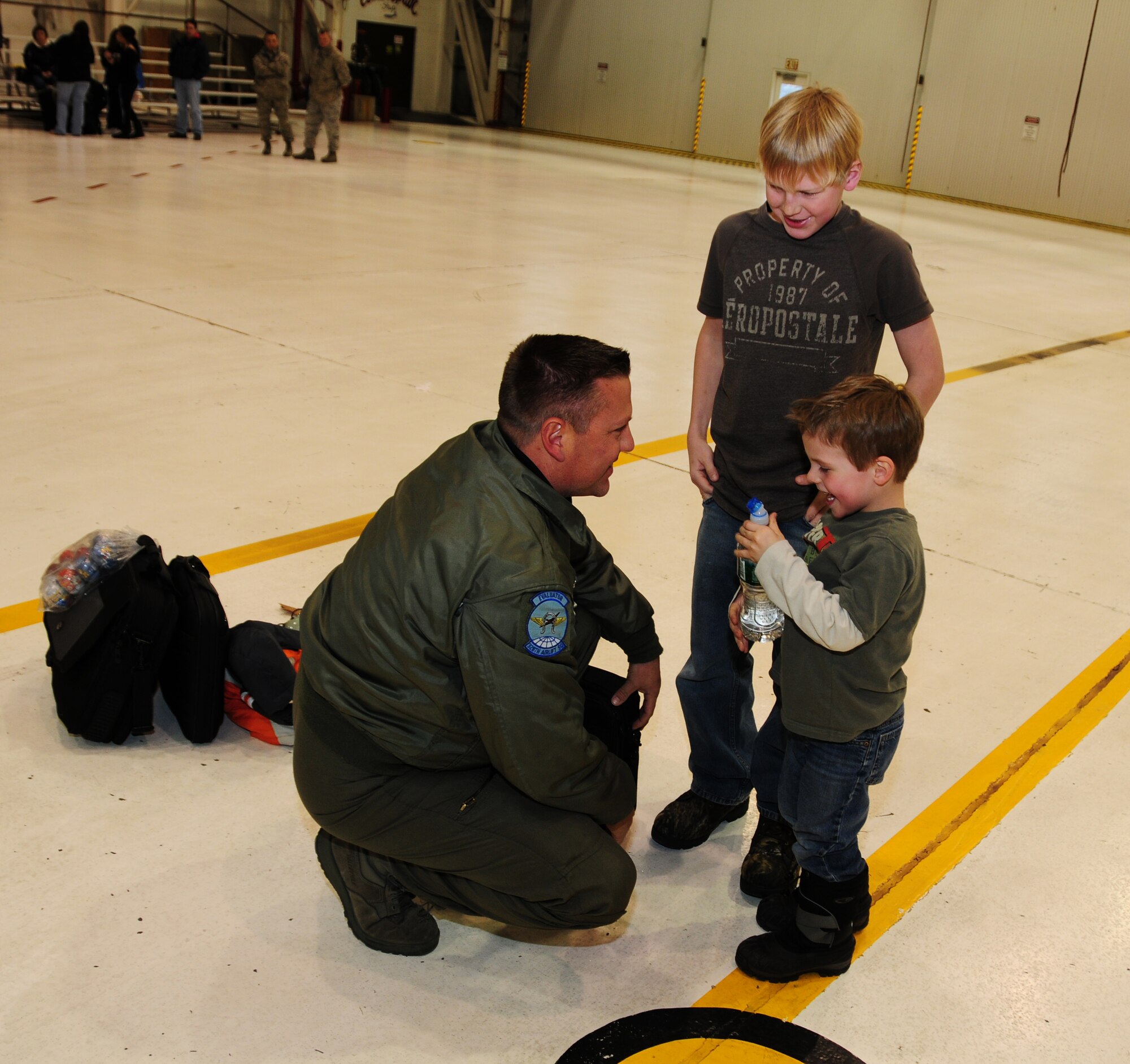 NIAGARA FALLS AIR RESERVE STATION, NIAGARA FALLS, NY-- Senior Master Sgt Aaron Achenbach is reunited with sons Aidan and Andrew, January 16. (U.S. Air Force photo by Staff Sgt Stephanie Clark)