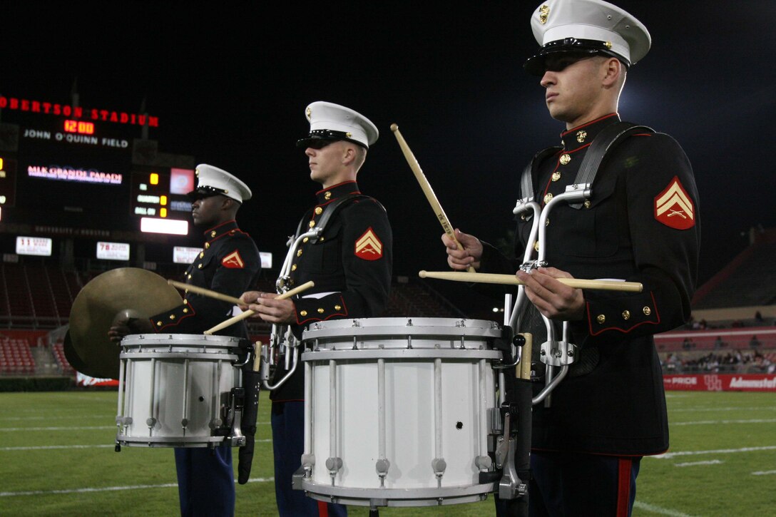 Cpls. Colin Hurowitz and Matthew Whittaker and Lance Cpl. Leonard Martin, all members of the 3rd Marine Aircraft Wing Band, play the 9th annual Martin Luther King Jr. High School Battle of the Bands competition in Houston Jan. 16.