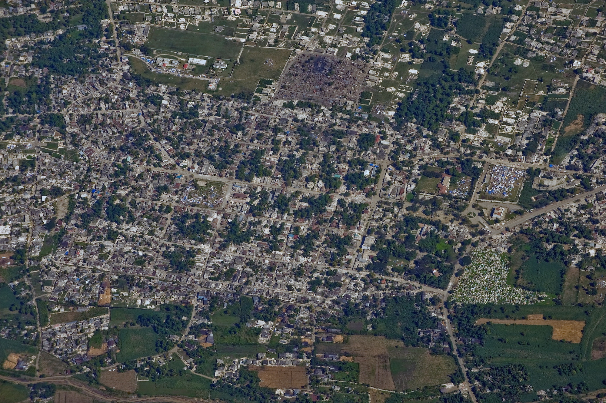 An aerial view of Port-au-Prince, Haiti from an OC-135B Observation Aircraft Jan. 14. The OC-135B flew over Haiti for over three hours taking panoramic photos to help coordinate U.S. military support to the Haiti relief effort. (U.S. Air Force photo by Airman 1st Class Perry Aston) (Released)