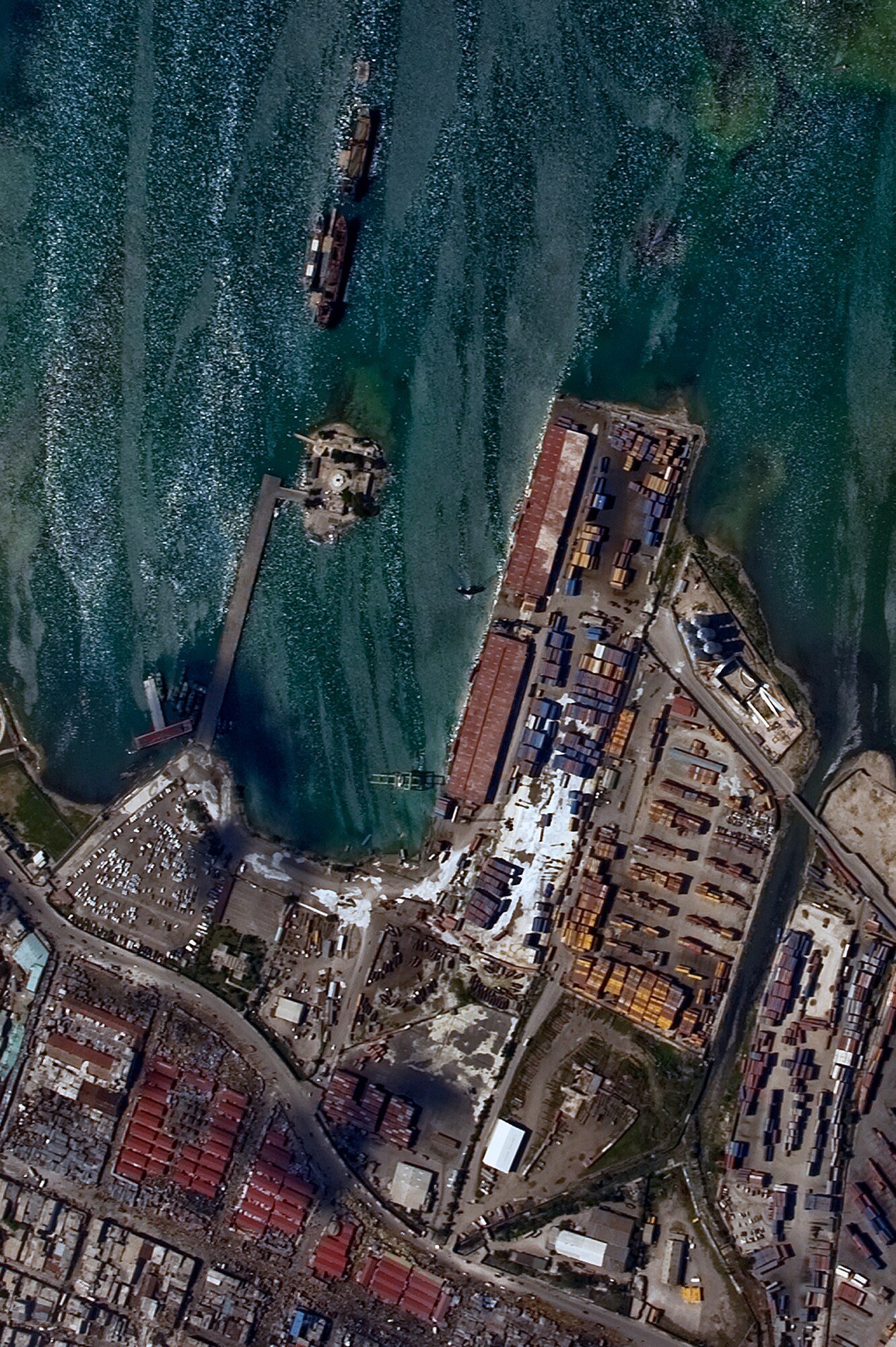 An aerial view of Port-au-Prince harbor in Haiti from an OC-135B Observation Aircraft Jan. 14. The OC-135B flew over Haiti for over three hours taking panoramic photos to help coordinate U.S. military support to the Haiti relief effort. (U.S. Air Force photo by Airman 1st Class Perry Aston) (Released)