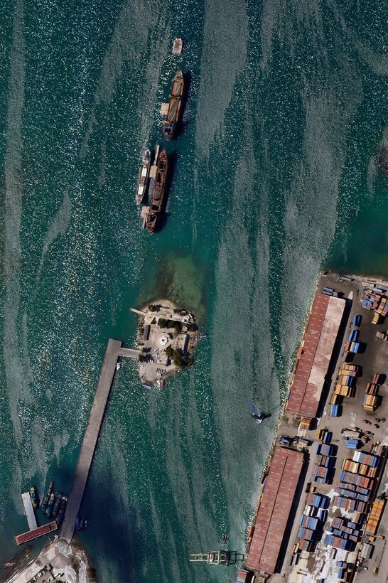 An aerial view of Port-au-Prince harbor in Haiti from an OC-135B Observation Aircraft Jan. 14. The OC-135B flew over Haiti for over three hours taking panoramic photos to help coordinate U.S. military support to the Haiti relief effort. (U.S. Air Force photo by Airman 1st Class Perry Aston) (Released)