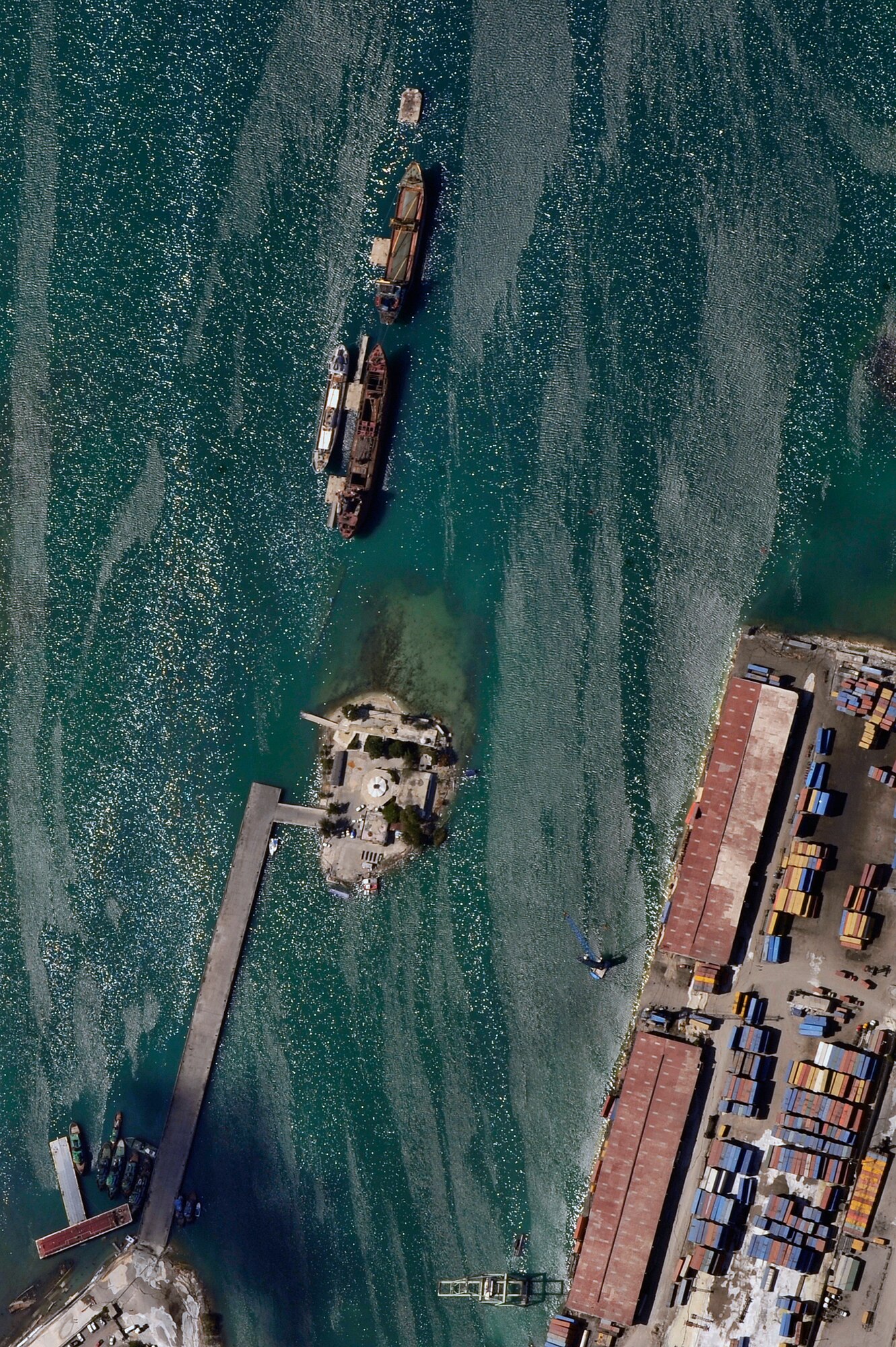An aerial view of Port-au-Prince harbor in Haiti from an OC-135B Observation Aircraft Jan. 14. The OC-135B flew over Haiti for over three hours taking panoramic photos to help coordinate U.S. military support to the Haiti relief effort. (U.S. Air Force photo by Airman 1st Class Perry Aston) (Released)