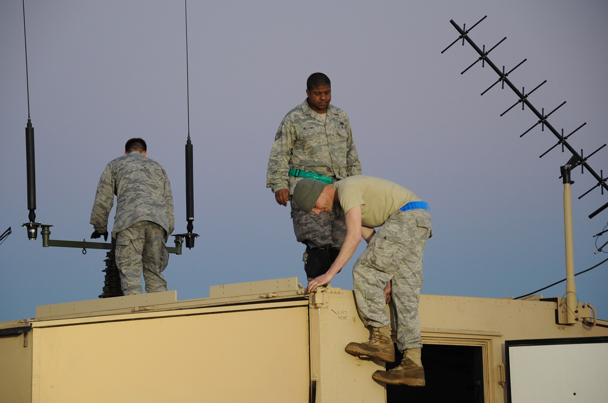 PORT AU PRINCE, Haiti -- Members of the 621st Contingency Response Wing set up a hardsided expandable light air-mobile shelter at the Port au Prince airport Friday. The HELAMS serves as the unit's headquarters while deployed to Haiti and will have satellite communications and other capabilities crucial to the wing's mission at the airfield. (U.S. Air Force photo/Staff Sgt. Danielle Johnson)