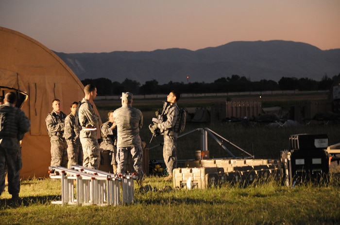 PORT AU PRINCE, Haiti -- Airmen of the 621st Contingency Response Wing gather outside their makeshift headquarters at the Port au Prince airport Friday. The wing will be responsible for organizing the airfield and setting up a reception area for relief supplies delivered to the airport. (U.S. Air Force photo/Staff Sgt. Danielle Johnson)