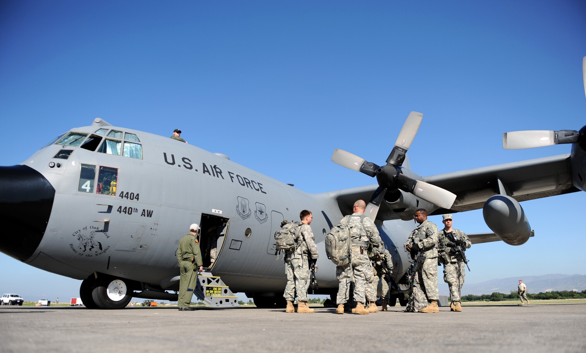 100115-F-2034C-065
Members of the 82nd Airborne Division get off a C-130 Hercules Jan. 15, 2010 after arriving at Port-au-Prince, Haiti. The C-130, from the 2nd Airlift Squadron, Pope Air Force Base, Fayetteville, North Carolina, brought the Soldiers to Haiti as part of the relief efforts being conducted by the DoD. U.S. Southern Command is deploying assets to Haiti to conduct search and rescue operations, damage assessments, and transitions sustained Humanitarian Assistance/Disaster Relief operations in order to prevent human suffering and additional loss of life. (U.S. Air Force photo/Master Sgt. Shane A. Cuomo) 
