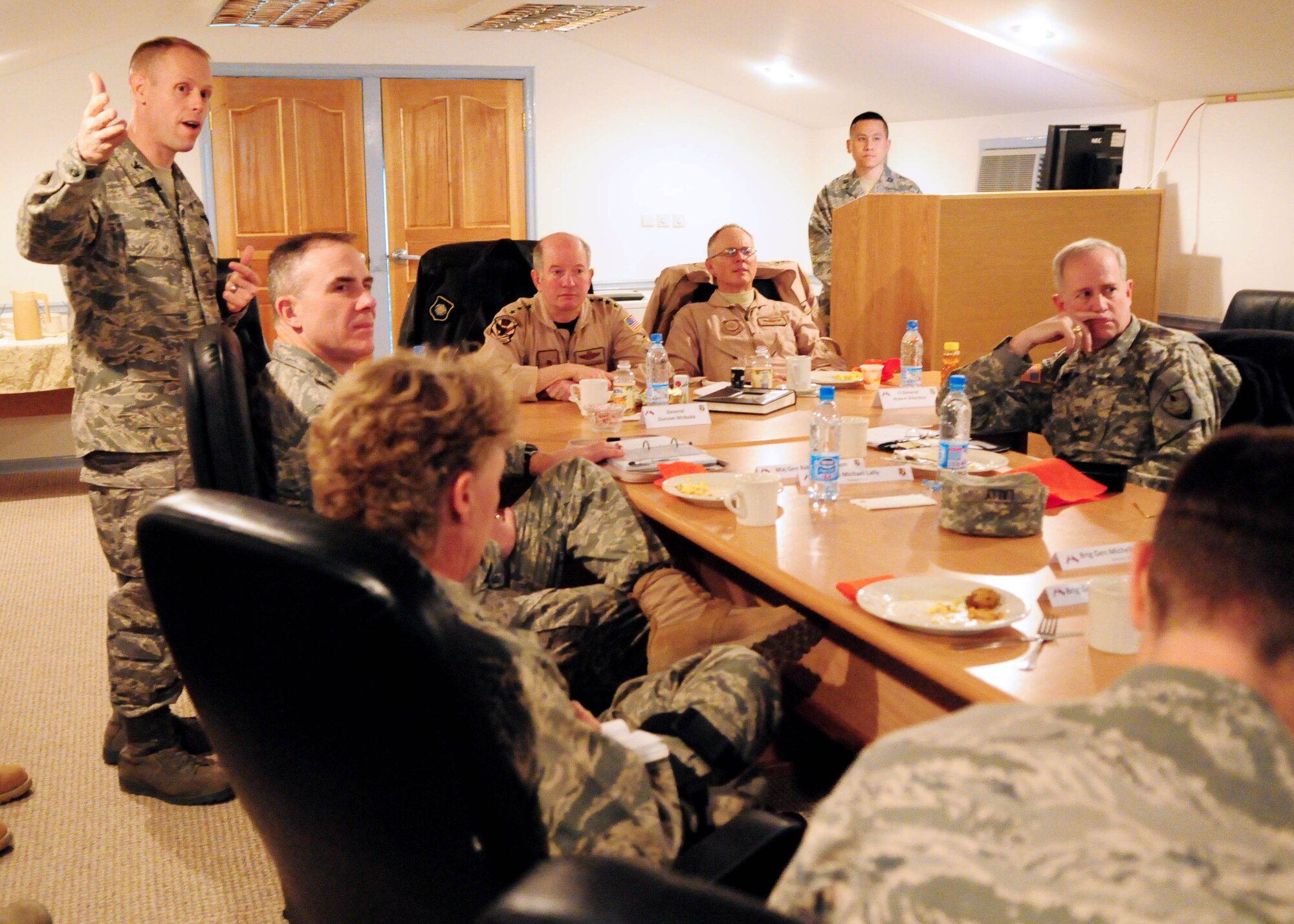 TRANSIT CENTER AT MANAS, Kyrgyzstan - Col. Blaine Holt, 376th Air Expeditionary Wing commander, gives a wing mission brief to Gen. Duncan McNabb, U.S. Transportation Command commander; Lt. Gen. Robert R. Allardice, 18th Air Force commander; Maj. Gen. Robert H. McMahon and other distinguished visitors during a site visit here Jan. 17. (U.S. Air Force photo by Senior Airman Nichelle Anderson)