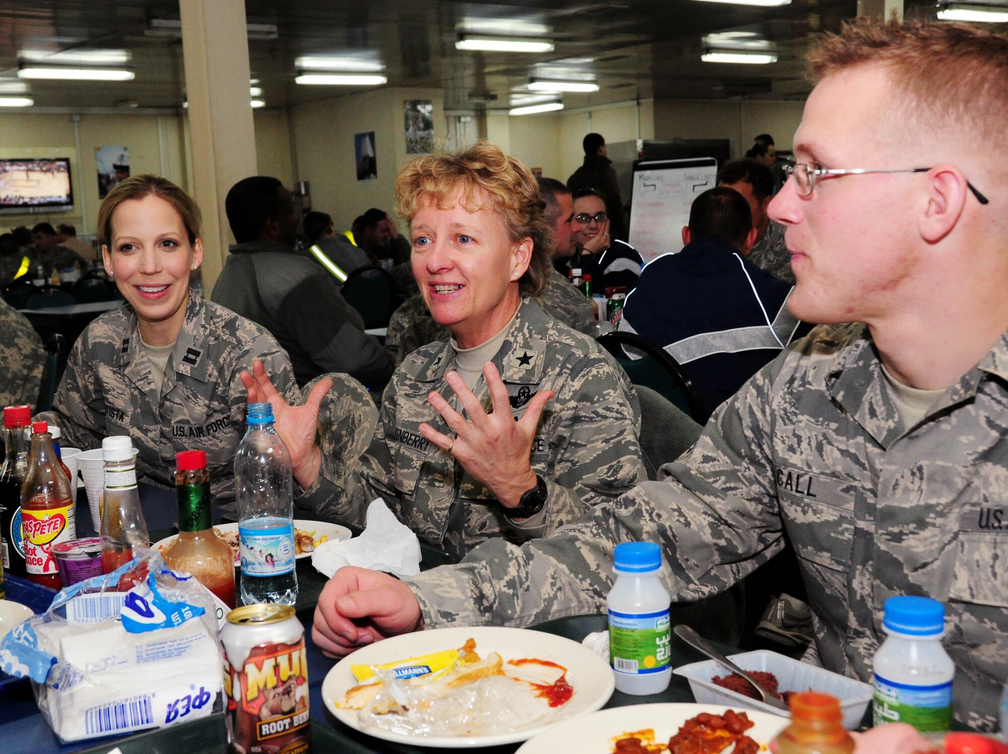 TRANSIT CENTER AT MANAS, Kyrgyzstan - Brig. Gen. Barbara Faulkenberry, commander, 15th Expeditionary Mobility Task Force, Travis Air Force Base, Calif., speaks with Senior Airman Nathan Call and other Airmen during a site visit here Jan. 16. Airman Call is an aircraft armament system specialist from the 355th Aircraft Maintenance Squadron, Davis-Monthan Air Force Base, Ariz. He is transiting home after a six-month deployment to Kandahar, Afghanistan. (U.S. Air Force photo by Senior Airman Nichelle Anderson)