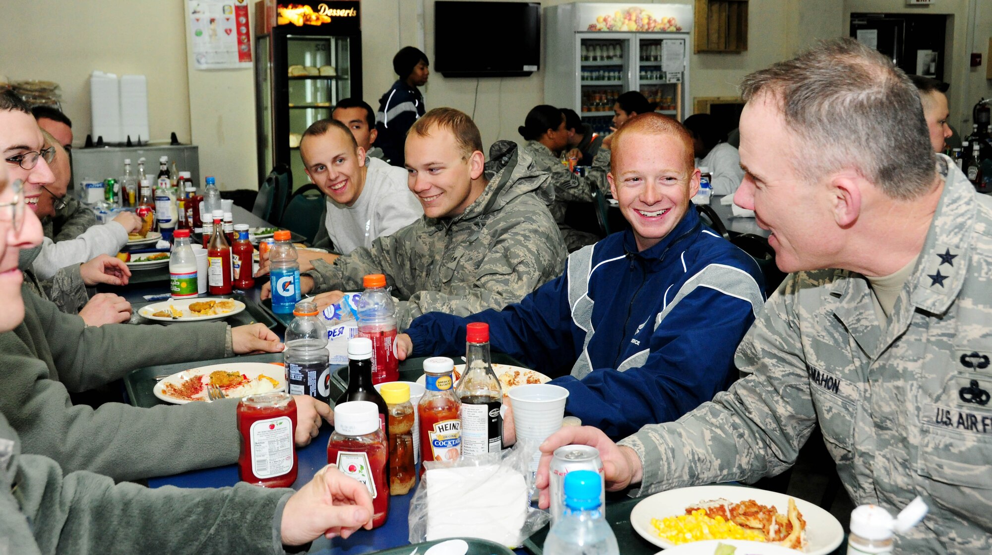 TRANSIT CENTER AT MANAS, Kyrgyzstan - Maj. Gen. Robert H. McMahon, Director of Logistics, Deputy Chief of Staff for Logistics, Installations and Mission Support, Headquarters U.S. Air Force, Washington, D.C., speaks with Airmen over dinner here Jan. 16. The maintenance Airmen are transiting home from Kandahar, Afghanistan and are from the 355th Aircraft Maintenance Squadron, Davis-Monthan Air Force Base, Ariz. (U.S. Air Force photo by Senior Airman Nichelle Anderson)