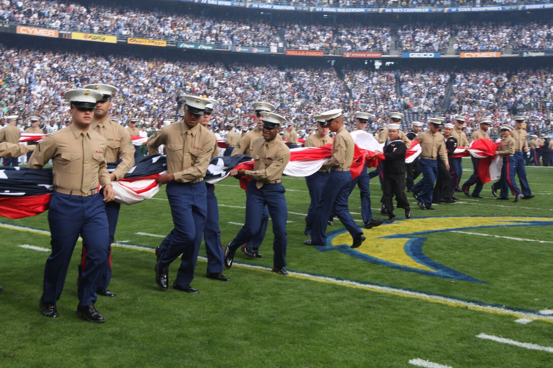 More than 150 Marines from Marine Corps Air Station Miramar prepare to unfurl one of four American flags during the Chargers’ pre-game ceremony, Jan. 17. After the ceremony, the Marines enjoyed the playoff game between the San Diego Chargers and New York Jets.