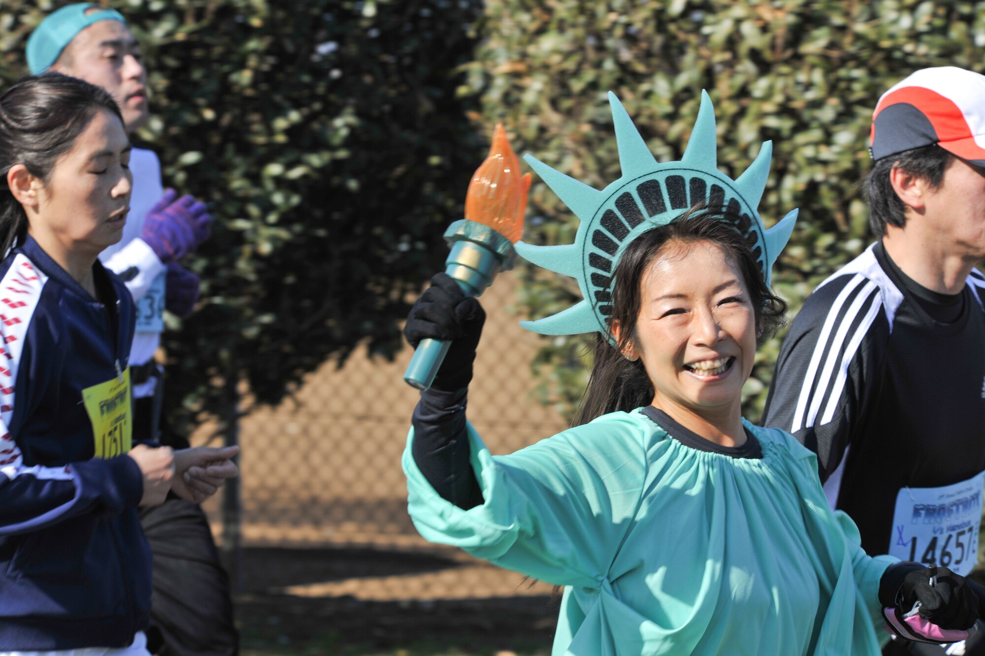 YOKOTA AIR BASE, Japan -- A runner dressed as a statue of liberty participates in the 29th Annual Frostbite Race, Jan. 17.  Some of the 9,000 runners who participated chose to wear costumes, because it has become an established custom every year.  (U.S. Air Force photo/Osakabe Yasuo)