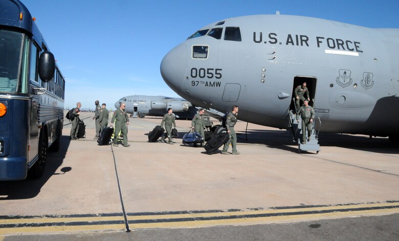 ALTUS AIR FORCE BASE, Okla. -- Four aircrews load onto a C-17 Globemaster III that is bound for Pope Air Force Base, N.C., Jan. 18. From Pope AFB the aircrews will be sectionalized and sent to participate in Operation Unified Response. Sixty-four base personnel left Altus AFB to provide humanitarian relief for Haiti. (U.S. Air Force photo/Senior Airman Cherice Bryant)